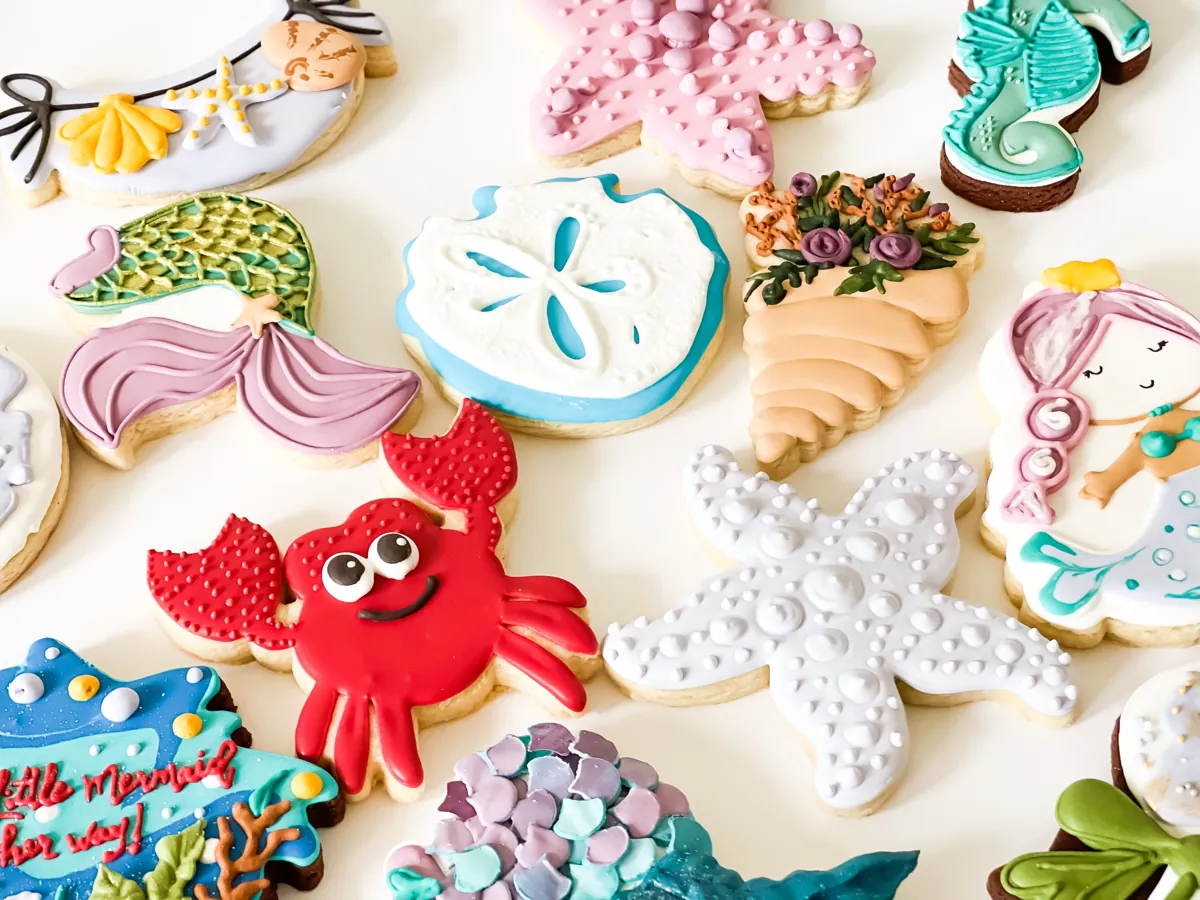 Under the sea mermaid birthday cookies with starfish, crab, seahorse and mermaid tail